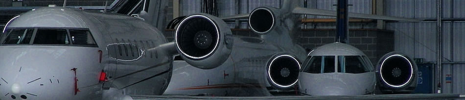 Luton airport jets in hangar Luton airport jets in hangar